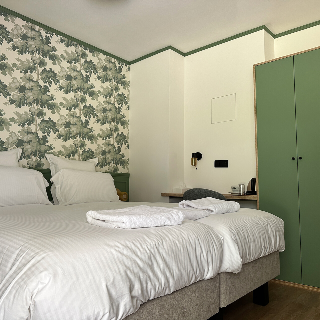 Aperçu d'une chambre Twin verte au rez-de-chaussée de l'hôtel
